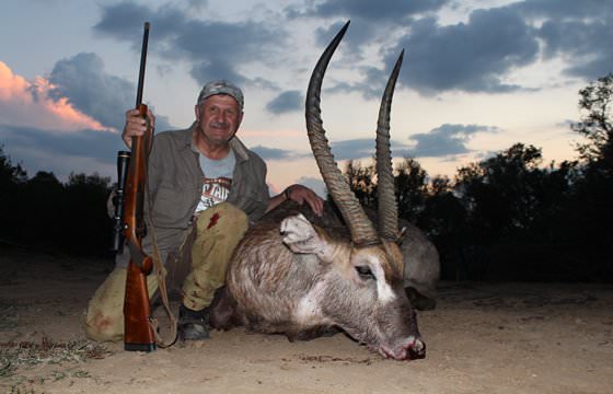 A hunter with his waterbuck trophy.