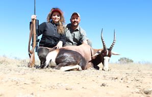 A huntress with her professional hunter and bontebok trophy.
