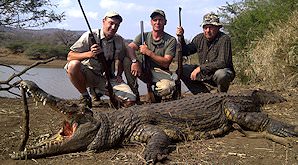A team of hunters with their crocodile trophy in Zimbabwe.