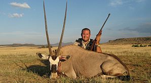 A hunter sits behind his gemsbok trophy in the Free State.