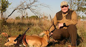 An impala ram is presented for a hunting shot.