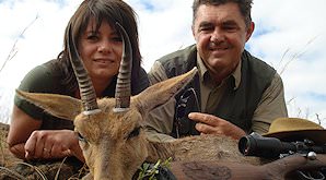 A pair of hunters with their mountain reedbuck trophy.
