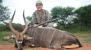 A hunter poses with his nyala trophy.