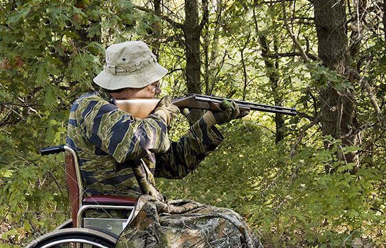 A hunter in a wheelchair prepares to take his shot.