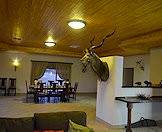 A kudu trophy welcomes guests to the dining room.