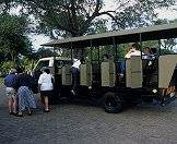 Guests prepare to depart on an open-air game drive in the Kruger Park.