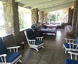 Chairs and day beds on the patio.