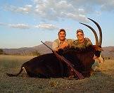A proud pair of hunters with their sable antelope trophy.