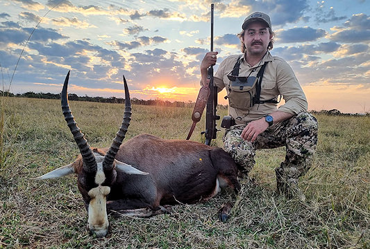 A hunter presents his blesbok trophy for a photograph.