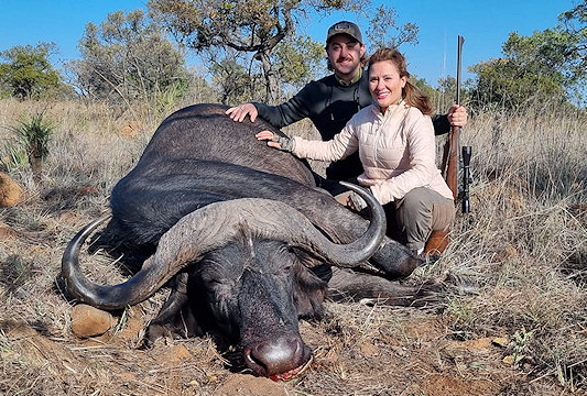 A hunter with his Cape buffalo trophy.
