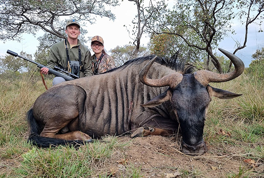 A huntress with her professional hunter and bontebok trophy.