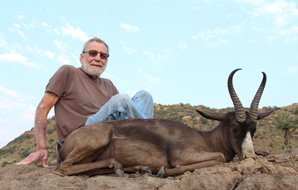 A proud hunter with his unique black springbok trophy.