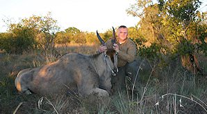 A hunter poses with his eland trophy.