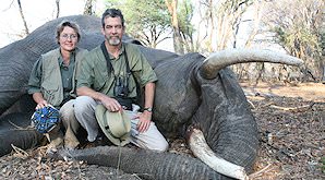 A pair of hunters with an elephant they hunted in Zimbabwe.