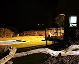 The deck overlooking the pool area at night.