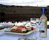 A cheese platter and wine prepared for guests at the camp.