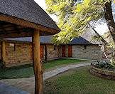 The camp has been construched with thatched roofs, wooden beams and light-colored bricks.