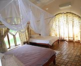 Two double beds in one of the bedrooms.