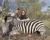 Hunters present their zebra for the camera.