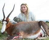 A huntress and her blesbok trophy.