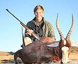 A young hunter with his blesbok trophy.
