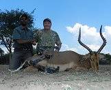 A team of bow hunters with their impala trophy.