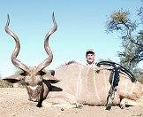 A bow hunter with his kudu trophy.
