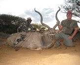 A bow hunting team with a kudu trophy.