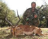 A bowhunter with his impala trophy.
