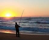 Fishing at dusk on the shores of the Cape.