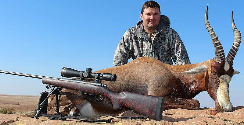 A hunter poses proudly with his blesbok trophy taken on the 5 Day Beginner's Free State Hunting Package.