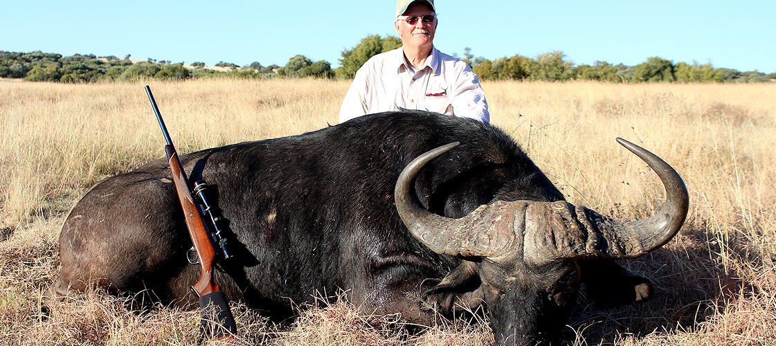 A proud hunter with his Cape buffalo trophy.